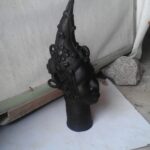 Modern bronze sculpture by Rafiu Adam, blending traditional African motifs with contemporary design, showcasing artistic innovation.