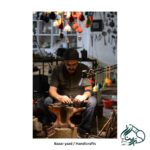 Photograph by Hoda Allameh of a master artisan crafting handicrafts in the traditional market of Yazd, capturing the artistry and cultural heritage.